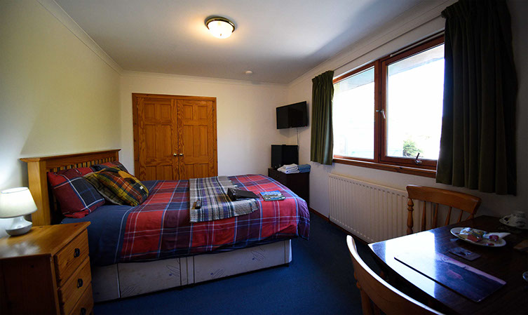 Kenmore Bed and Breakfast accommodation contains a double bed with fridge smart TV and tea coffee making facilities